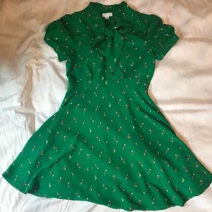 Kelly green flirty dress with bow collar